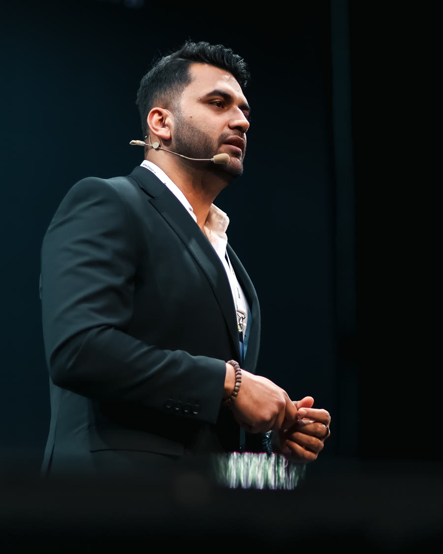 Bhanu Chawla delivering a keynote on stage